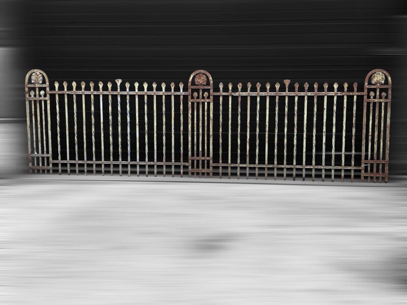 Wrought iron gates with a fence